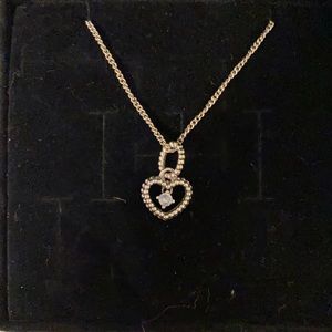 Blue pendant necklace with adjustable chain.